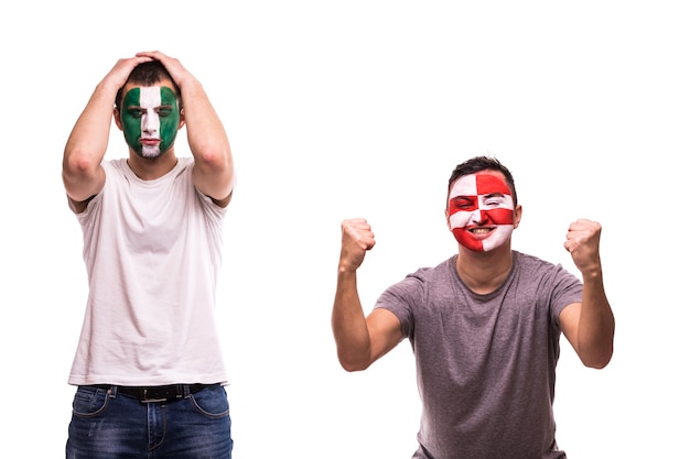 クロアチアの幸せなサッカーファンは 塗装された顔でナイジェリアの動揺したサッカーファンの勝利を祝います 無料の写真