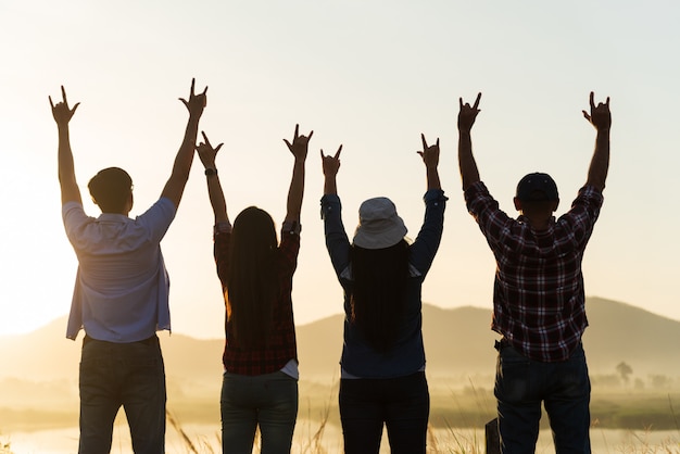 Premium Photo | Happy friends are having fun with raised arms together ...