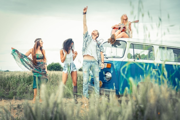 Premium Photo | Happy friends driving a vintage minivan