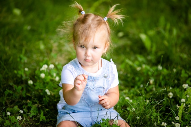 Premium Photo Happy Funny Blonde Baby Girl With Two Little Braids