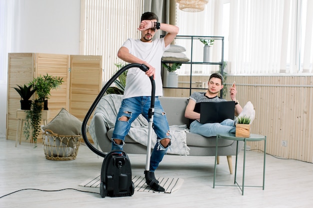 Premium Photo Happy Gay Man Cleaning Home Dancing With Vacuum Cleaner And Having Fun