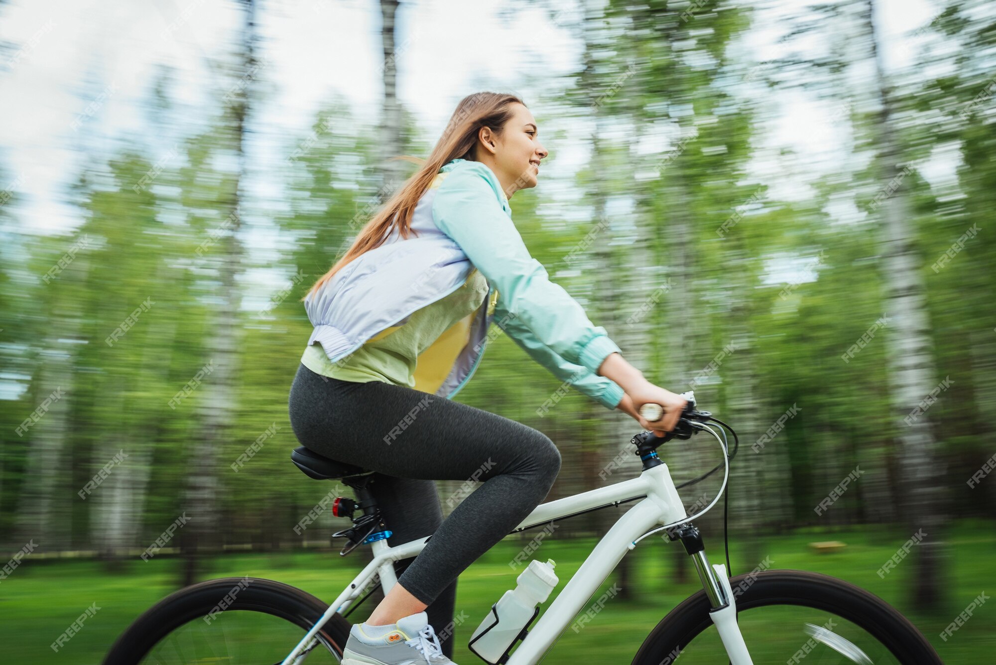 Free Photo | Happy girl cyclist riding on a mountain bike outside ...