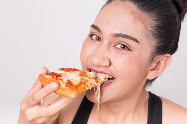 Happy Girl Eating Tasty Pizza Isolated On A White Background Photo