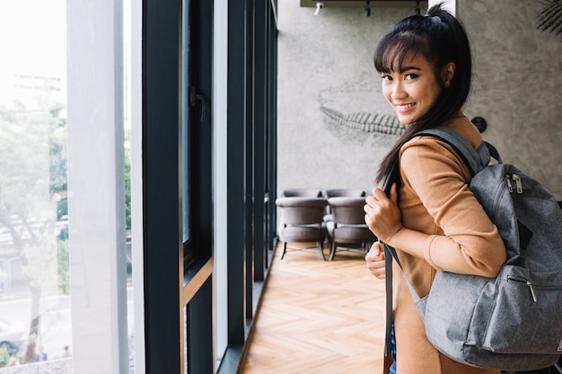 girl holding backpack