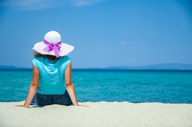 Premium Photo | Happy girl at sea in greece on sand nature