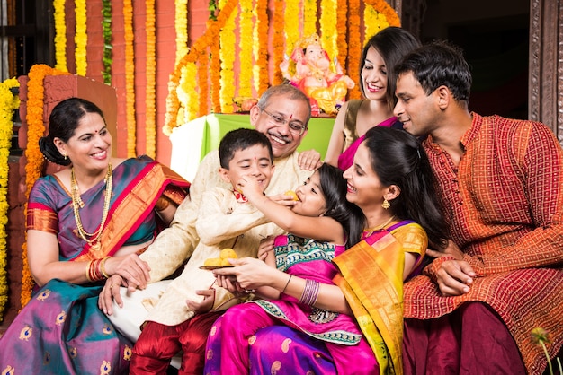 Premium Photo | Happy indian family celebrating ganesh festival or ...