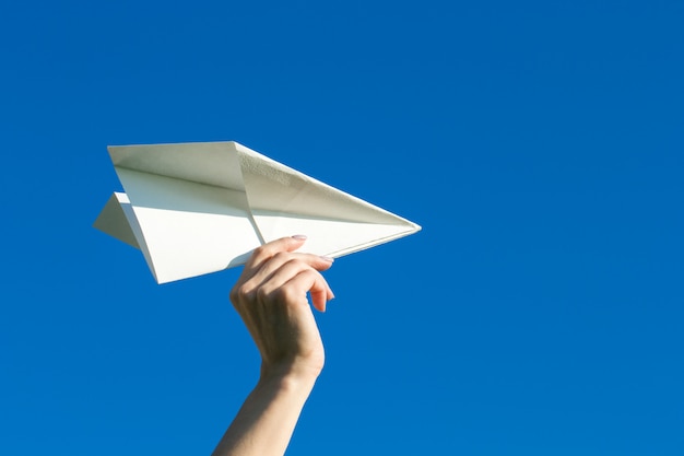 Premium Photo | Happy kid playing with paper airplane