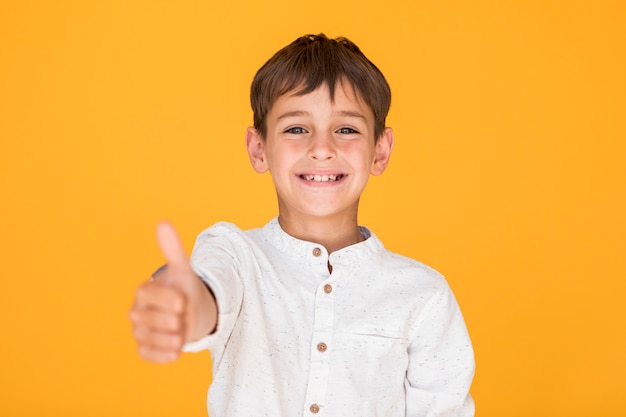 Happy kid showing the like sign Photo | Free Download