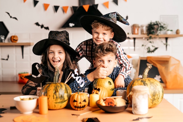 Premium Photo | Happy kids celebrate halloween at home magical holiday mood