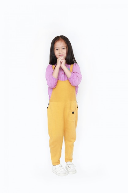 Premium Photo | Happy little asian child girl in dungarees expression ...