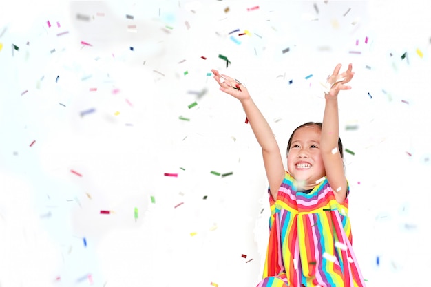 Premium Photo | Happy little child girl with colorful confetti on white ...