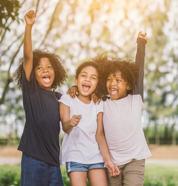 Premium Photo | Happy little children joyfully cheerful and laughing.  concept of happiness,.