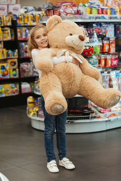 girl with giant teddy bear