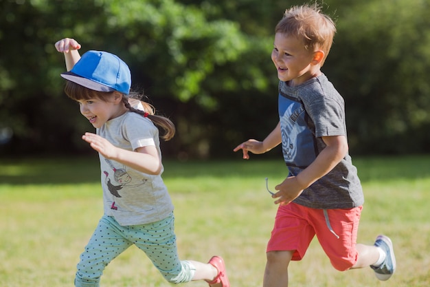 Premium Photo | Happy little kids playing catch-up