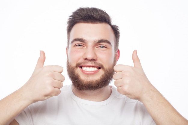 Premium Photo | Happy man giving thumbs up sign