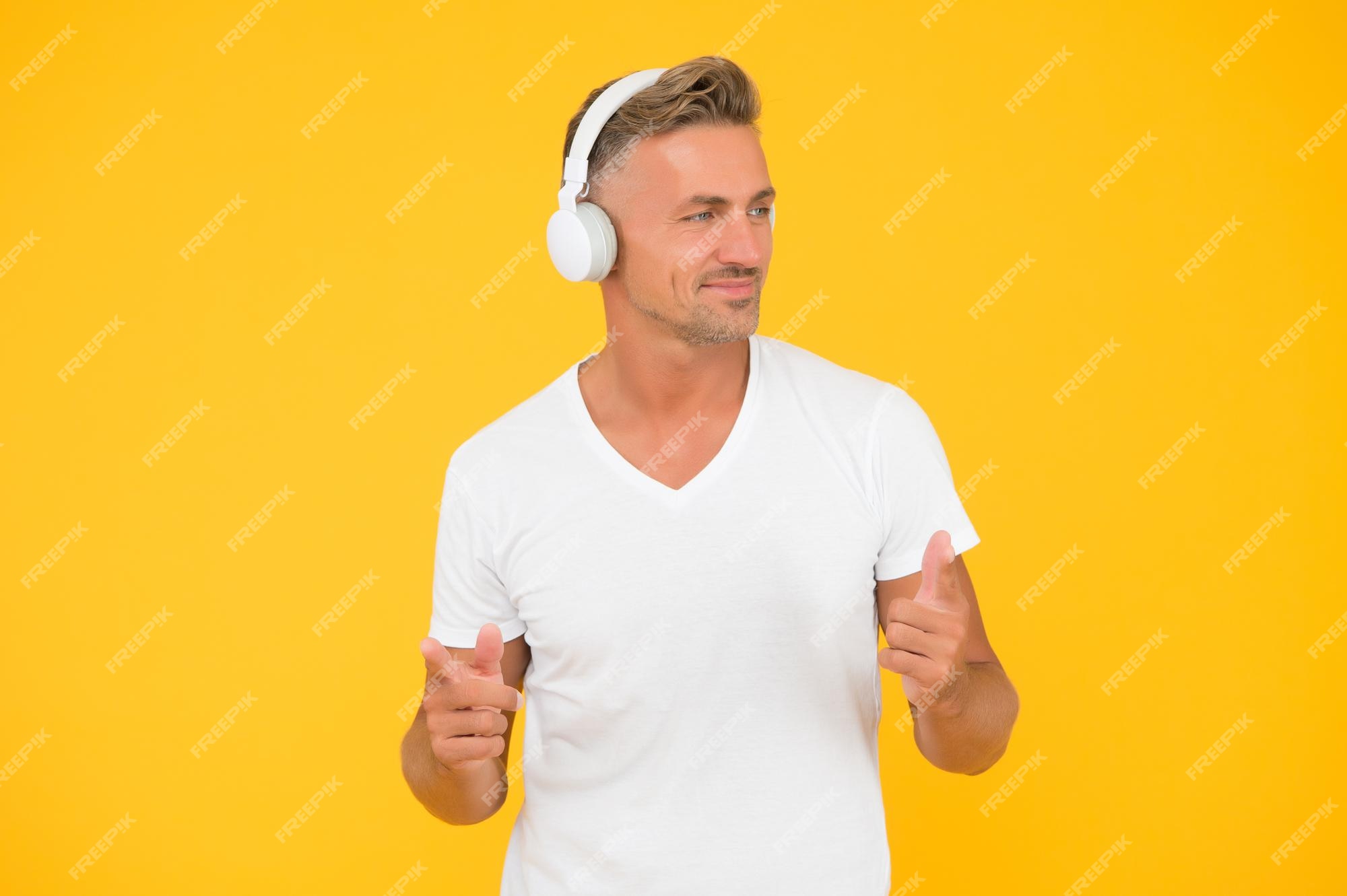 premium-photo-happy-middleaged-man-listen-to-music-in-modern