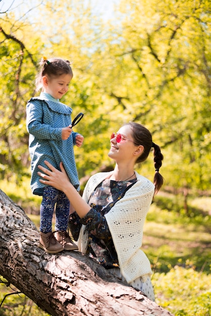 Happy mother with kid in nature Free Photo