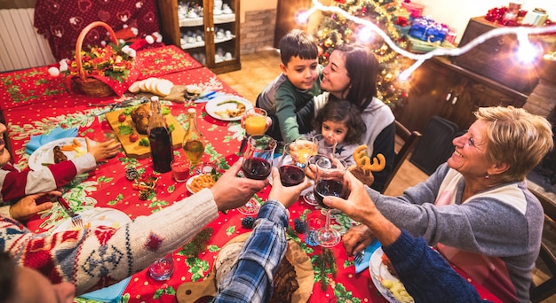 Premium Photo | Happy multi generation family having fun at christmas ...