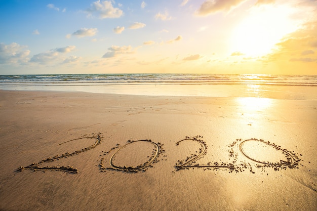 Happy New Year 2020 Text On Beautiful The Sea Beach With Wave