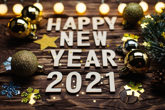 Premium Photo | Happy new year 2021. symbol from number 2021 on wooden background