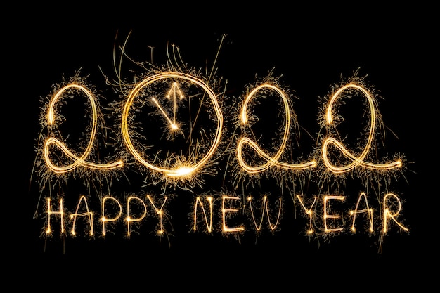 Happy new year 2022 sparkling burning text happy new year 2022 isolated on black background beauti Free Photo