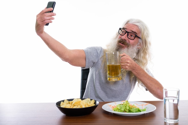 Premium Photo Happy Senior Bearded Man Smiling While Taking Selfie