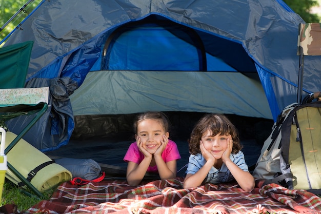 Premium Photo | Happy siblings on a camping trip