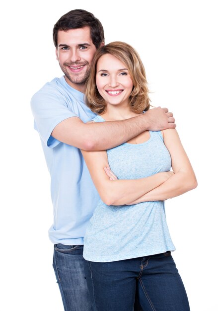 Free Photo Happy Smiling Couple Standing Together Looking At Camera