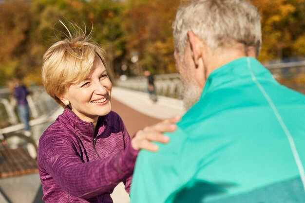 Premium Photo Happy Sporty Senior Couple Having Workout Outdoors