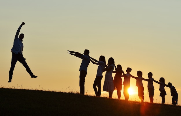 Premium Photo | Happy successful people silhouettes outdoors