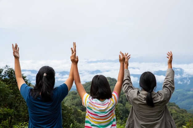 Free Photo | Happy teens deep breath fresh air on top mountain ...