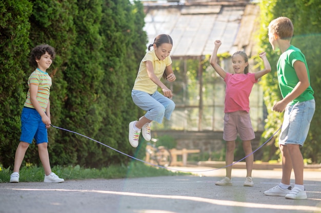 Premium Photo | Happy time. joyful emotional girl with pigtails jumping ...