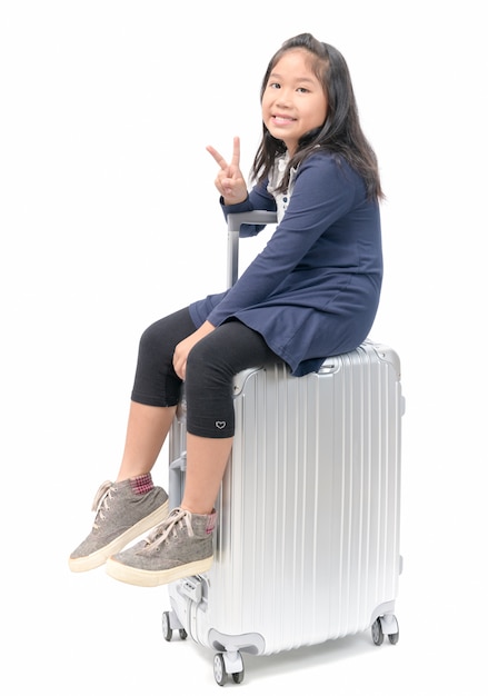 sit on luggage