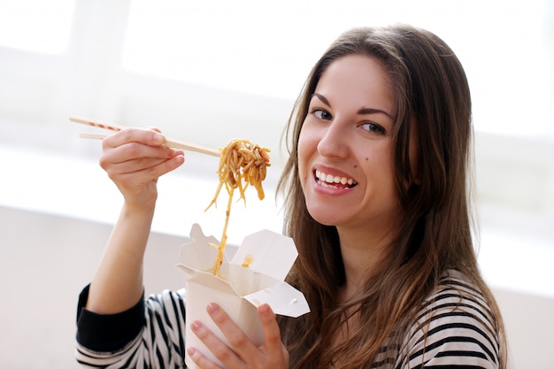 Free Photo Happy Woman Eating Noodles