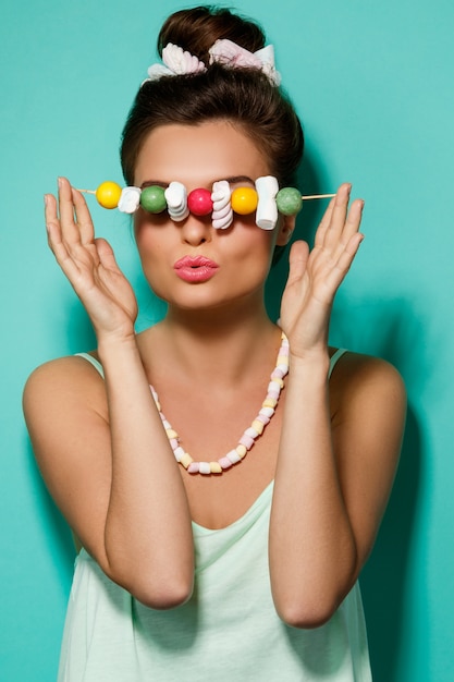 Premium Photo Happy Woman With Colorful Makeup And Sweet Candies On