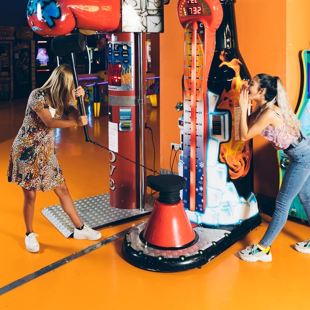 Free Photo | Happy women playing arcade game