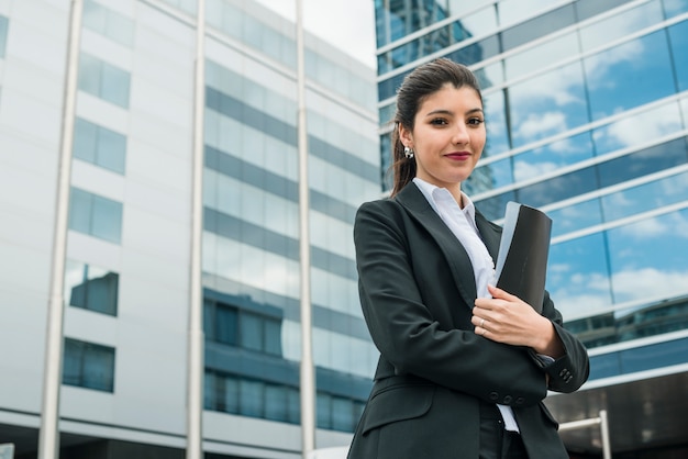 happy-young-businesswoman-holding-folder