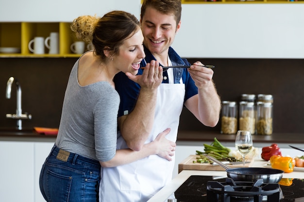 Premium Photo Happy Young Couple Cooking Together In The Kitchen At Home 5454