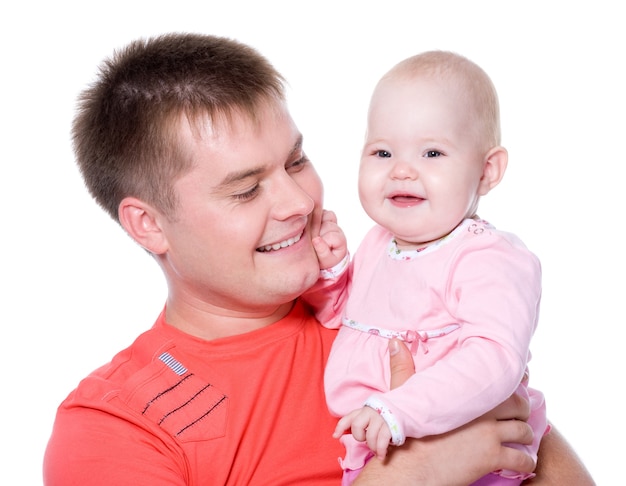 Free Photo | Happy young father with attractive smile holding his baby on