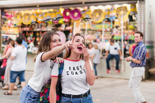 Free Photo | Happy young friends in the amusement park