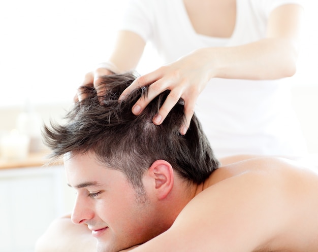 happy-young-man-receiving-a-head-massage