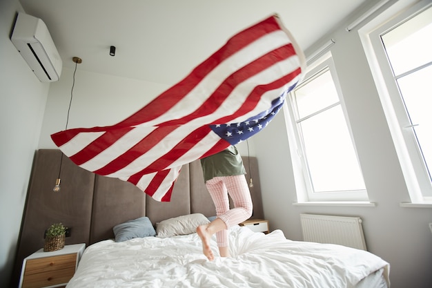 american flag over bed