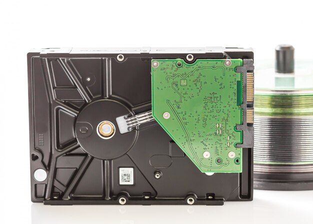 Premium Photo | Hard disk drive and compact discs