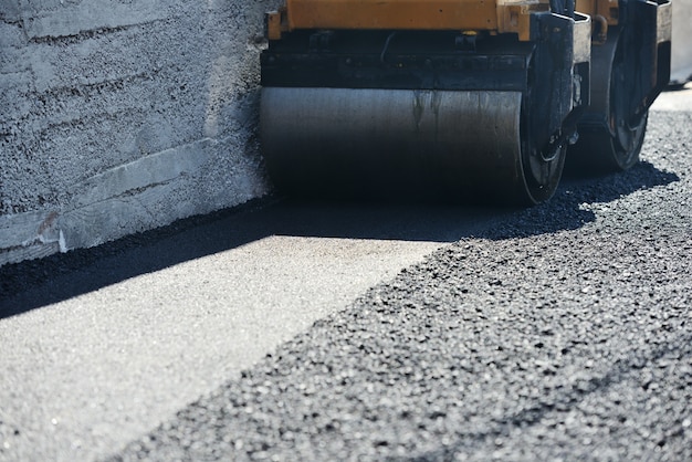 Premium Photo | Hard work on asphalt construction