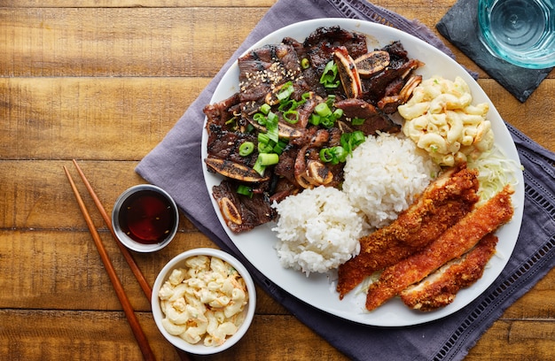 Premium Photo Hawaiian Bbq Plate With Mix Of Chicken Katsu Korean Kalbi Beef Short Ribs Rice And Macaroni Salad Overhead Composition