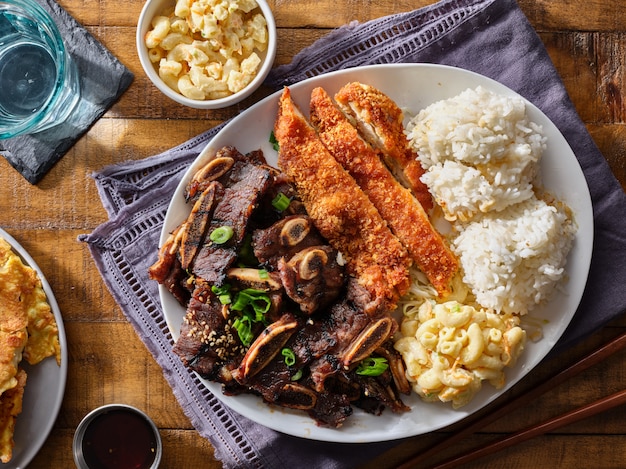 Premium Photo Hawaiian Bbq Plate With Mix Of Chicken Katsu Korean Kalbi Beef Short Ribs Rice And Macaroni Salad Overhead Composition