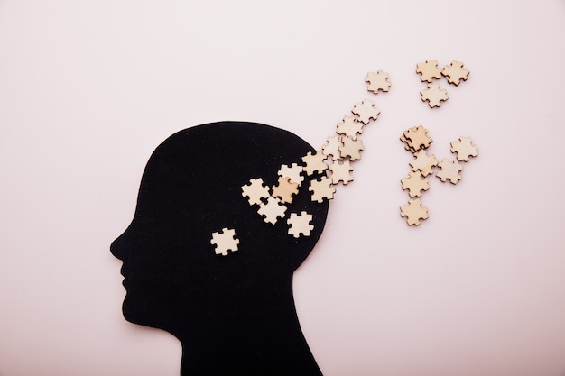 Premium Photo | Head of man and wooden puzzle alzheimers disease ...