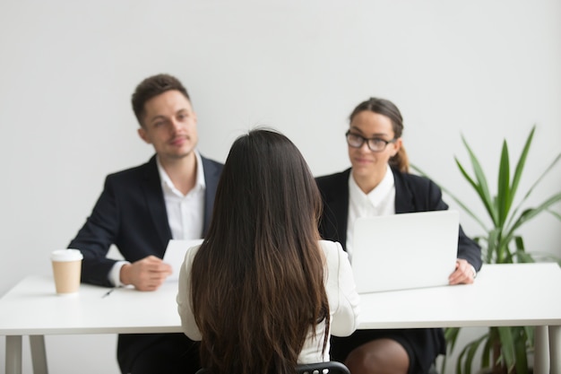 Headhunters interviewing female job candidate Free Photo