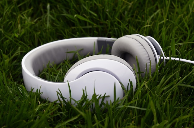 Premium Photo | Headphones on green grass