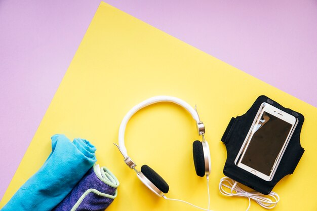 Headphones And Towels Near Smartphone Free Photo